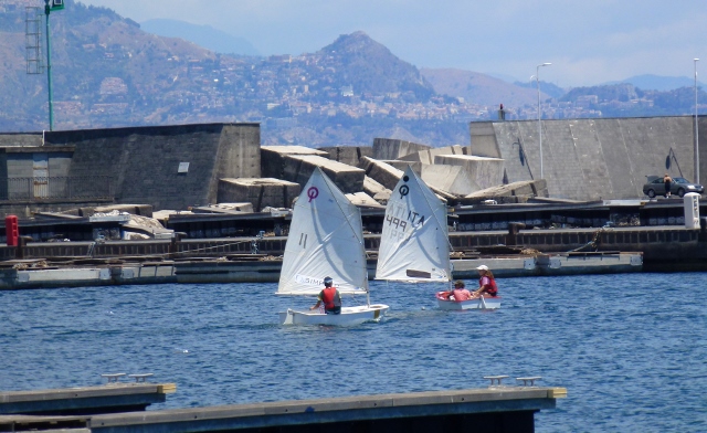 Youth sailors training in their Optimists in the sheltered area in the yet to be built marina extension